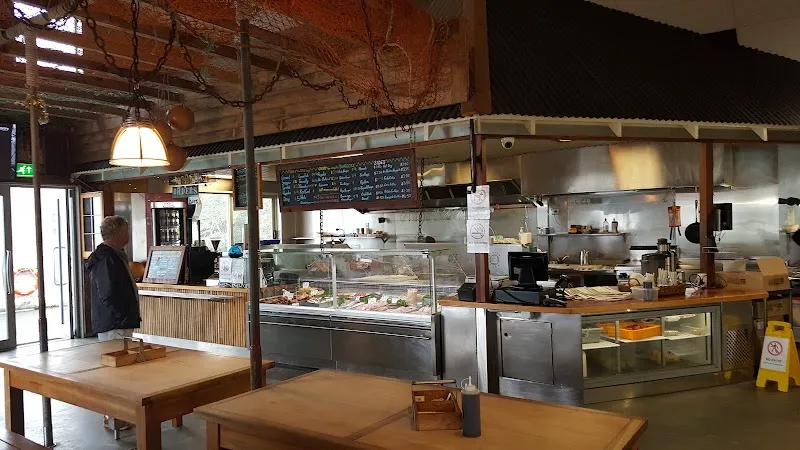 Raglan Fish fresh seafood counter and chalkboard menu at Raglan Wharf.